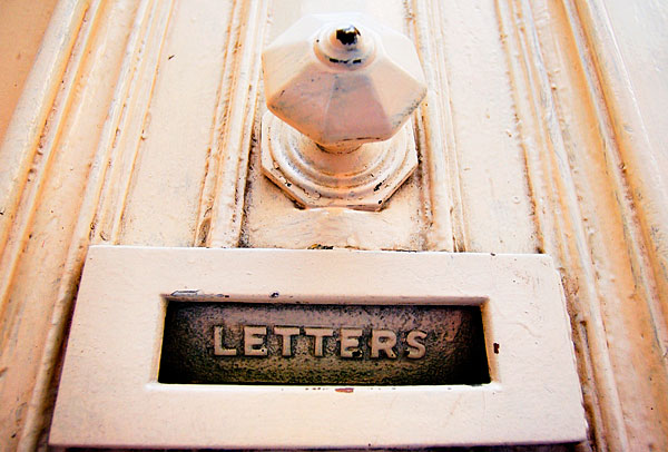 Contact Darlington Studios: Picture of a mail slot in a door